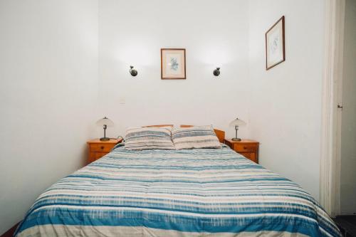 Ένα ή περισσότερα κρεβάτια σε δωμάτιο στο Hotel San Agustin