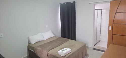 Giường trong phòng chung tại kitnet 3 paulista Douglas · Loft 3 Espaço Inteiro em Frente ao PQ Ecológico