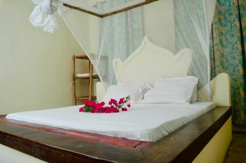 Ένα ή περισσότερα κρεβάτια σε δωμάτιο στο Rafiki budget master room in paje