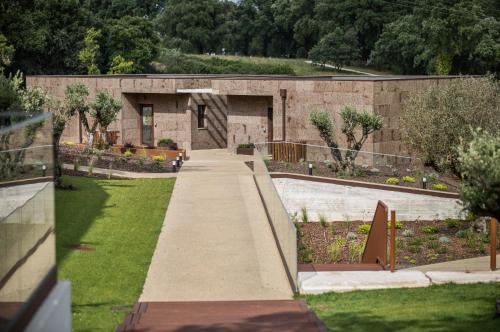 a building with a skateboard ramp in a park at Haven Nature Hotel & Villas in Batalha