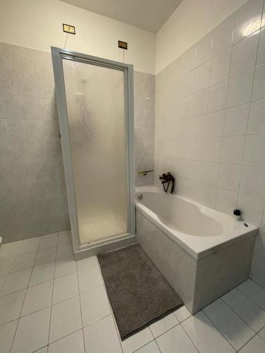 a bathroom with a shower and a bath tub at Casa Vacanza Patrizia in Bastia Umbra