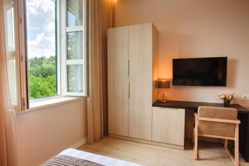 TV a/nebo společenská místnost v ubytování Hotel Stanica Ravno