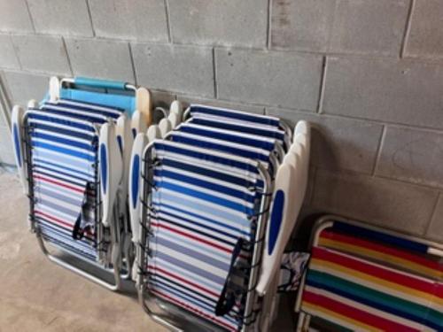 a row of blue and white towels on a rack at Island Time -- Oceanfront Bliss in Saint Augustine