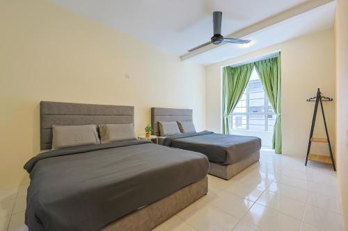 a bedroom with two beds and a window at Blissful Escape Perfect Homestay for Families & Friends Clover Home 3-03A in Brinchang