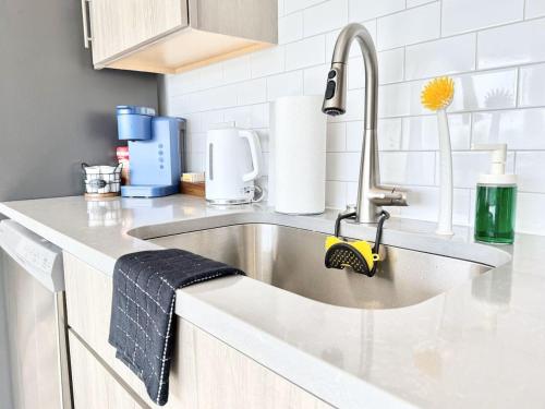 a kitchen counter with a sink in a kitchen at Central Philly 1Br Apt with Gym in Philadelphia