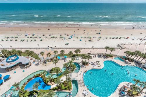 an aerial view of a resort with a beach at -New Listing- Completely Remodeled and Newly Furnished 3BR Direct Ocean Front Condo in Seabreeze