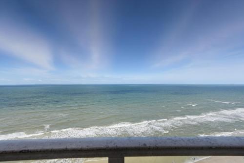 a view of the ocean from a balcony at -New Listing- Completely Remodeled and Newly Furnished 3BR Direct Ocean Front Condo in Seabreeze