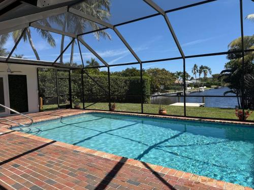 a swimming pool with a view of the water at Aqua Vista in Lake Clarke Shores