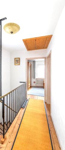a hallway with a staircase in a house at Ferienhaus Franziska in Münstermaifeld