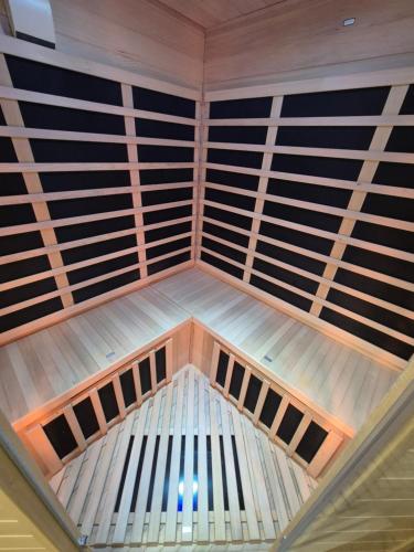 a ceiling view of a room with wooden panels at PoroszLove Vendégház in Poroszló