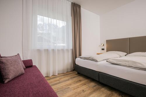 Katil atau katil-katil dalam bilik di Apartments Drei Zinnen