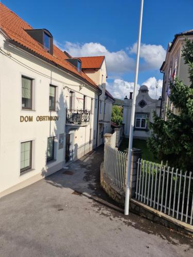 a white building with a fence in front of it at Antica Dolina in Postojna