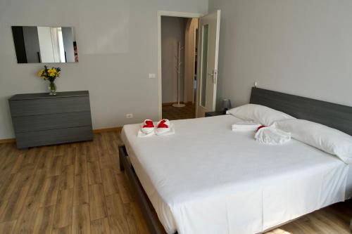 Postel nebo postele na pokoji v ubytování Adua Residence