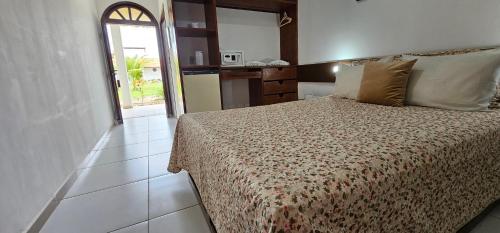 Postel nebo postele na pokoji v ubytování Hotel Praia do Conde