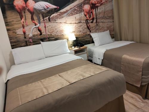 Ένα ή περισσότερα κρεβάτια σε δωμάτιο στο Hotel Soul Mate Inn