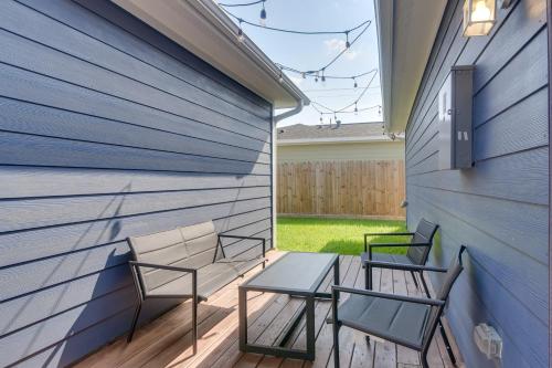 two chairs and a table on a patio at Patio and Fenced Yard Home Close to Dtwn Houston! in Jacinto City