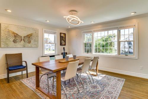 a dining room with a wooden table and chairs at New Haven Gem with Private Pool, Walk to Beach! in New Haven