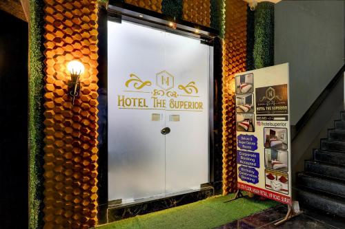 a door in a building with a sign on it at Hotel O The Superior in Bhatha