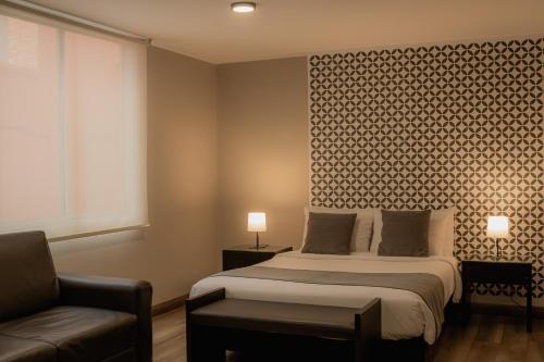 Hemma Bogotá Chapinero Premium Suites Hotelにあるベッド