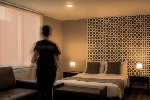 Hemma Bogotá Chapinero Premium Suites Hotelにあるベッド