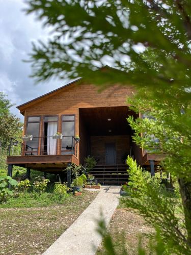 a house with a porch and a porch at Balda Novel House in Martvili