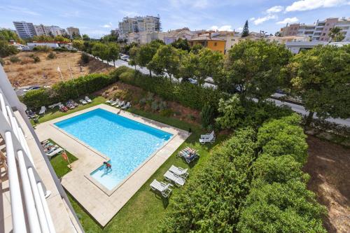 an overhead view of a swimming pool in a city at A52 - Quintão Apartment in Portimão in Portimão
