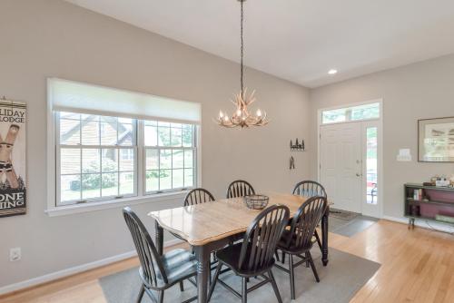 a dining room with a table and chairs at Cozy Cabin Right on the New River in Todd - Easy River Access - Fire Pit in Brownwood