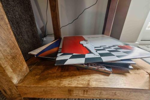 a table with a magazine on top of it at Hartley Lake Hideaway - The Perfect Getaway! in Brainerd