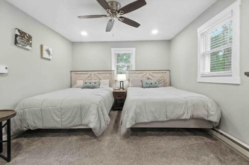 a bedroom with two beds and a ceiling fan at Hartley Lake Hideaway - The Perfect Getaway! in Brainerd