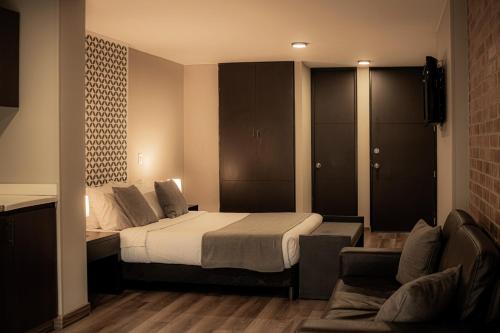 Hemma Bogotá Chapinero Premium Suites Hotelにあるベッド