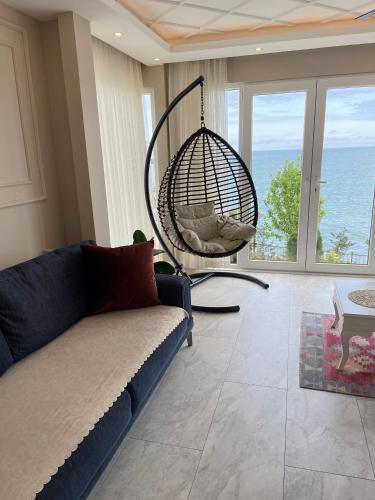 a living room with a couch and a swing at White Pearl in Trabzon