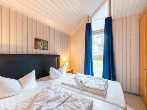 Postel nebo postele na pokoji v ubytování Ferienhaus mit toller Ausstattung