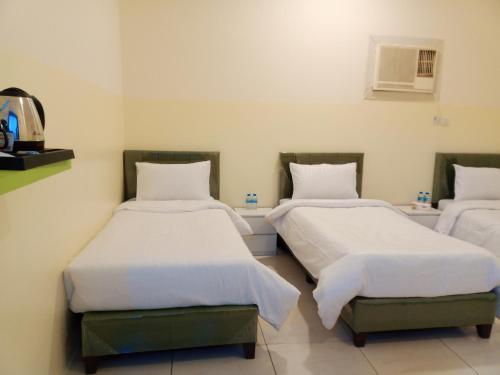 Ένα ή περισσότερα κρεβάτια σε δωμάτιο στο دار الرضا Dar Al Reda