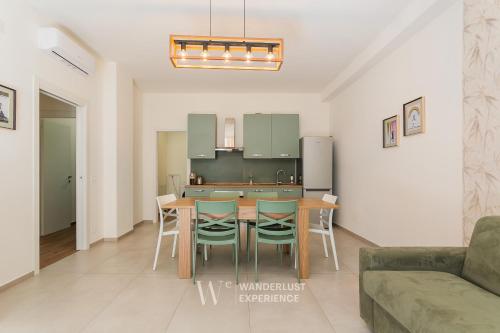 a kitchen and dining room with a table and chairs at Wanderlust Experience Le dimore di Alice in Bitonto