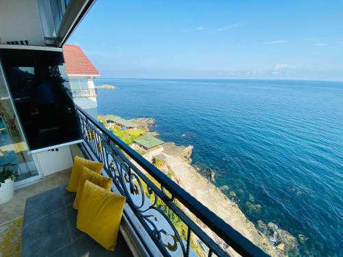 a balcony with a view of the ocean at White Pearl in Trabzon