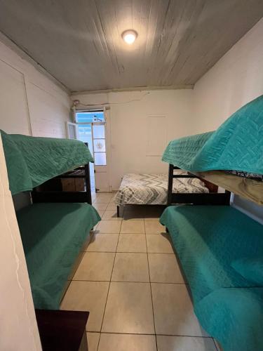 a small room with two bunk beds in it at Hostal Boutique Reina del Mar in Cartagena