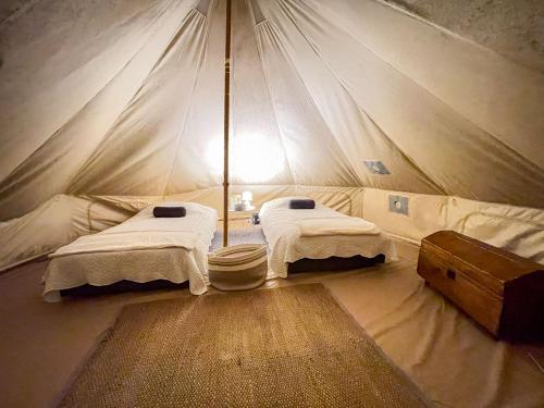 Ένα ή περισσότερα κρεβάτια σε δωμάτιο στο Palumbo Glamping & Villas