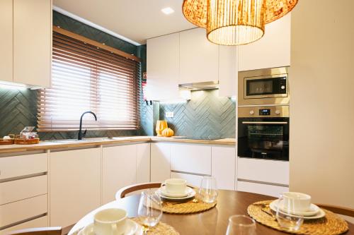 Kuchyň nebo kuchyňský kout v ubytování Espaço Quattro Apartamentos