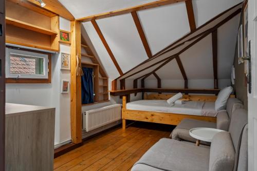a small room with two beds and a staircase at Interbelic Villa near Old Town in Bucharest