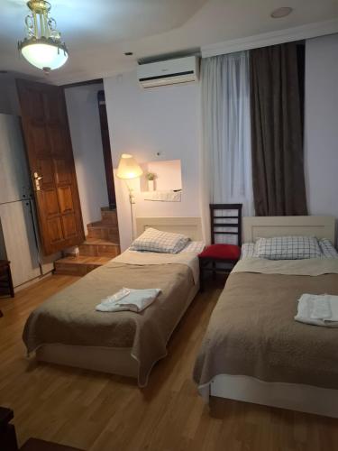 Postel nebo postele na pokoji v ubytování Guest House Lili