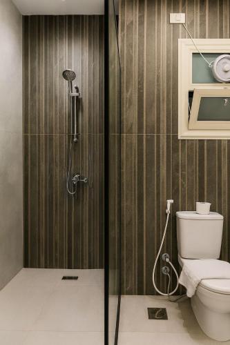 a bathroom with a shower and a toilet at Diva Suites in Hurghada
