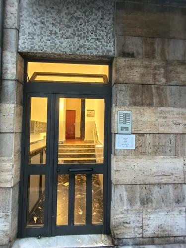 a door to a building with a sign on it at Marilissa Home in Bari