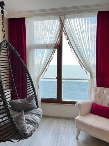 a room with a hammock in front of a window at White Pearl in Trabzon