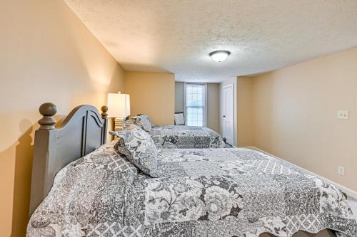 a bedroom with two beds and a window at Rural and Private Dover Retreat Close to Wineries! in Sugarcreek