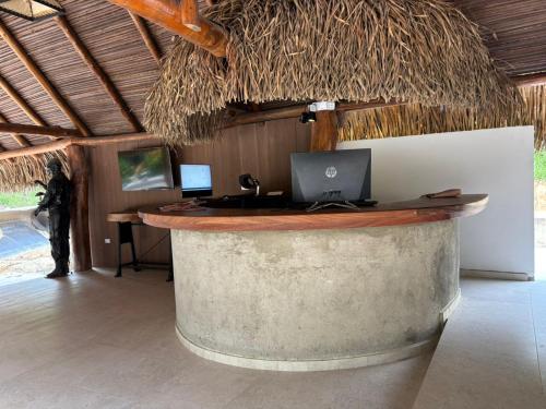 a bar with a laptop on top of a wine barrel at hacienda hotel texas in Durania