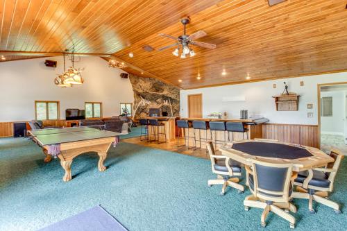 a living room with a ping pong table and a bar at Lakefront Home on 17 Acres 9 Mi to Dtwn Brainerd! in East Gull Lake