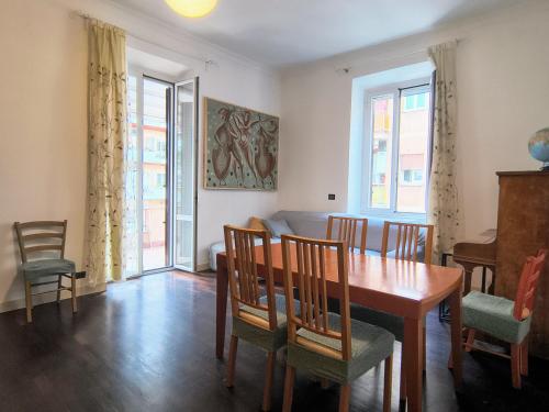 a dining room with a table and chairs at Domus Oleandri - WelcomeToRhome in Rome