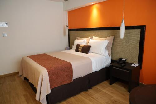 Кровать или кровати в номере Hotel Catedral