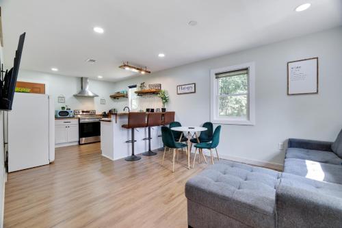 a living room and kitchen with a couch and a table at Cozy 2 Bedroom apartment in Tannersville, minutes from Camelback Mountain in Tannersville