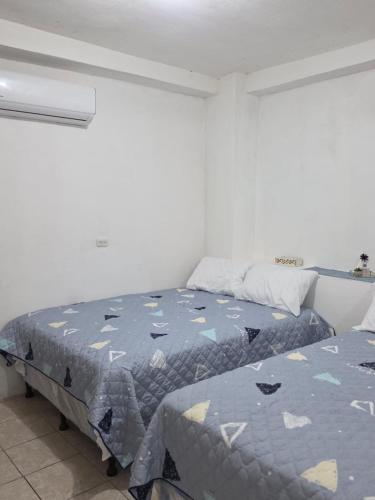 Postel nebo postele na pokoji v ubytování Yulis Home 2